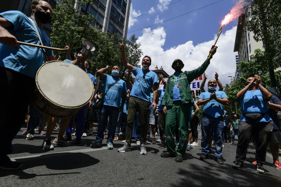 Protesters take part in a rally during a 24-hour labor strike, in Athens, Thursday, June 10, 2021. Widespread strikes in Greece brought public transport and other services to a halt Thursday, as the country's largest labor unions protested against employment reforms they argue will make flexible workplace changes introduced during the pandemic more permanent. (AP Photo/Michael Varaklas)