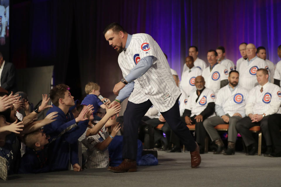 Kyle Schwarber works the room. He enters spring training 20 pounds lighter, eying a bounce-back season. (AP Photo/Charles Rex Arbogast)