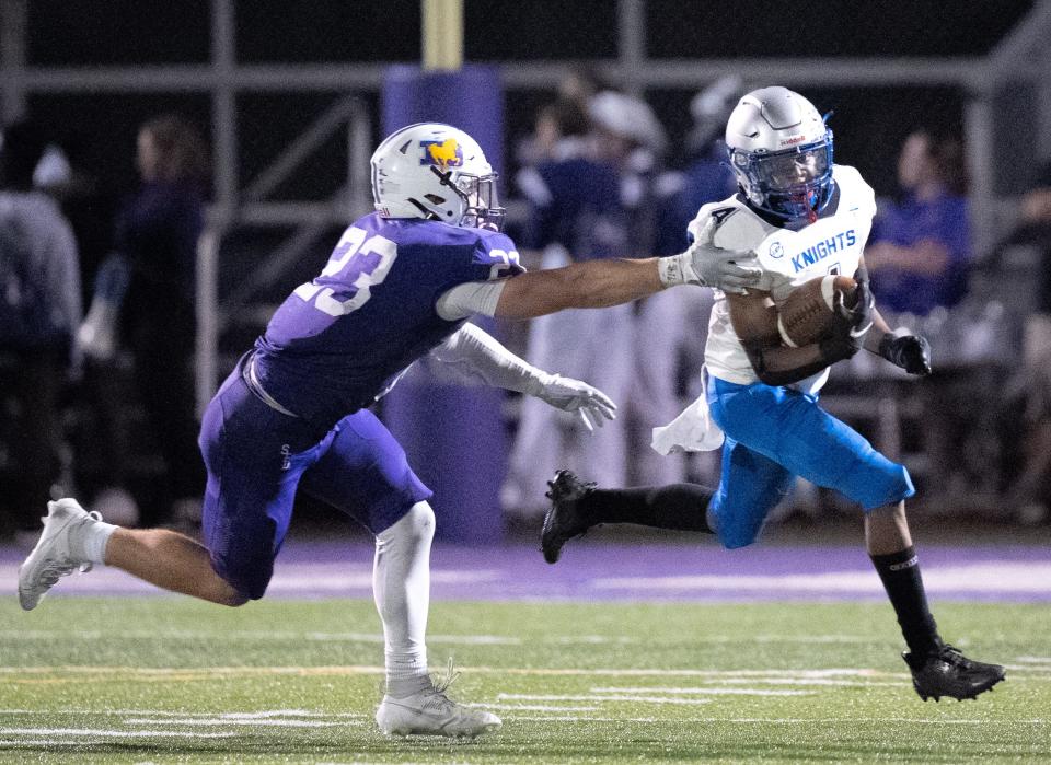 DeSales' Max Shulaw, left, attempts to tackle Ready's Joaquin Patterson during their game Sept. 15.