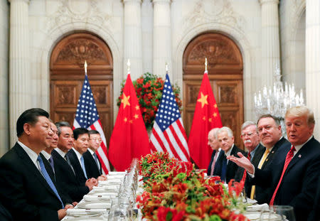 FILE PHOTO: U.S. President Donald Trump, U.S. Secretary of State Mike Pompeo, U.S. President Donald Trump's national security adviser John Bolton and Chinese President Xi Jinping attend a working dinner after the G20 leaders summit in Buenos Aires, Argentina December 1, 2018. REUTERS/Kevin Lamarque/File Photo