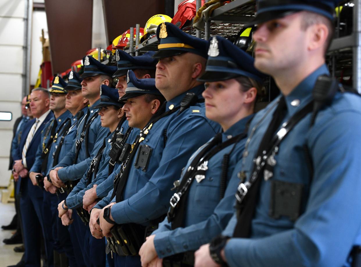 In a file photo, Massachusetts State Police troopers stand during a ceremony.