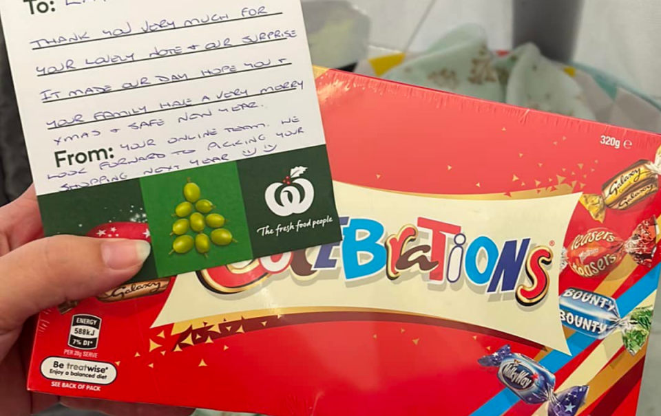 A box of Celebrations with a note from Woolworths staff.