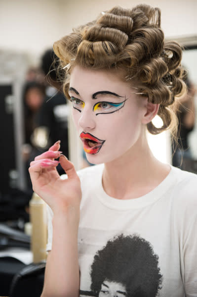 A model makes a shocked face backstage at Vivienne Westwood © Getty