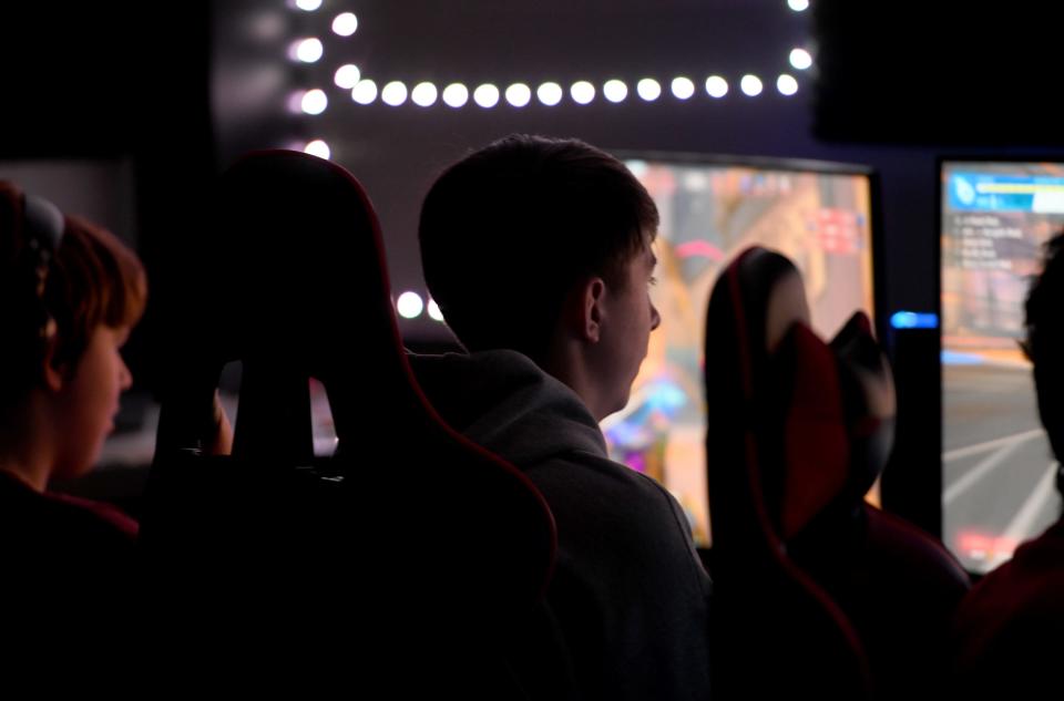 Sophomores Ryan Villard, left, and Alex Watson warm up with the McKinley High School esports team during practice at the school, Wednesday, Feb. 1, 2023.