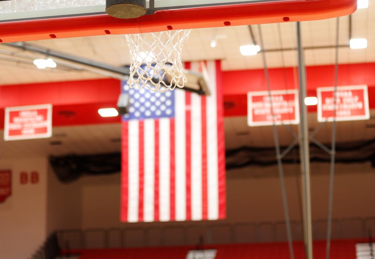 An American flag hangs in the background of Richmond High School's Tiernan Center Dec. 28, 2021, during the Bob Wettig Memorial Tournament.