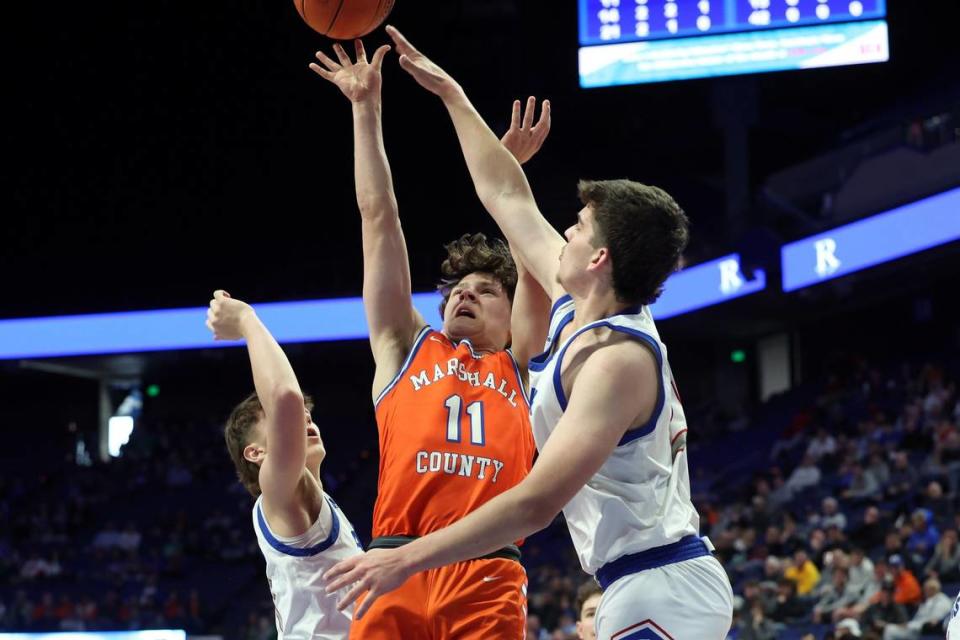 Alex Staples (11) led Marshall County with 13 points but nothing came easy for the Marshals against Adair County.