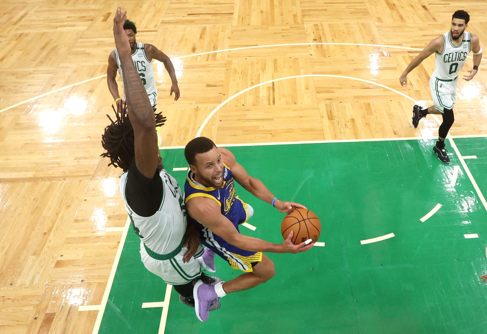 Stephen Curry drives the hoop during Game 6 of the 2022 NBA Finals. - Credit: gi