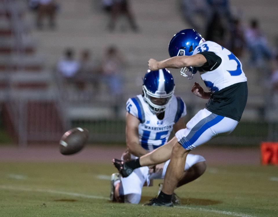 Ricky Bucco (33) kicks a field goal during the Booker T. Washington vs Tate football Kickoff Classic at Tate High School in Cantonment on Thursday, Aug. 17, 2023.