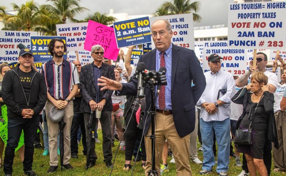 Protesters disrupt a press conference held by Miami Beach Mayor Dan Gelber at the corner of Ocean Drive and 10th Street in South Beach on Friday, Oct. 22, 2021. The protesters, who said they are hospitality workers, shouted their opposition to a proposed 2 a.m. ban on alcohol sales that Gelber has proposed. Gelber and former Miami Beach Mayor Philip Levine held the press conference to promote a citywide referendum on the Nov. 2 ballot that asks voters whether the city should ban alcohol sales after 2 a.m. at certain late-night businesses.
