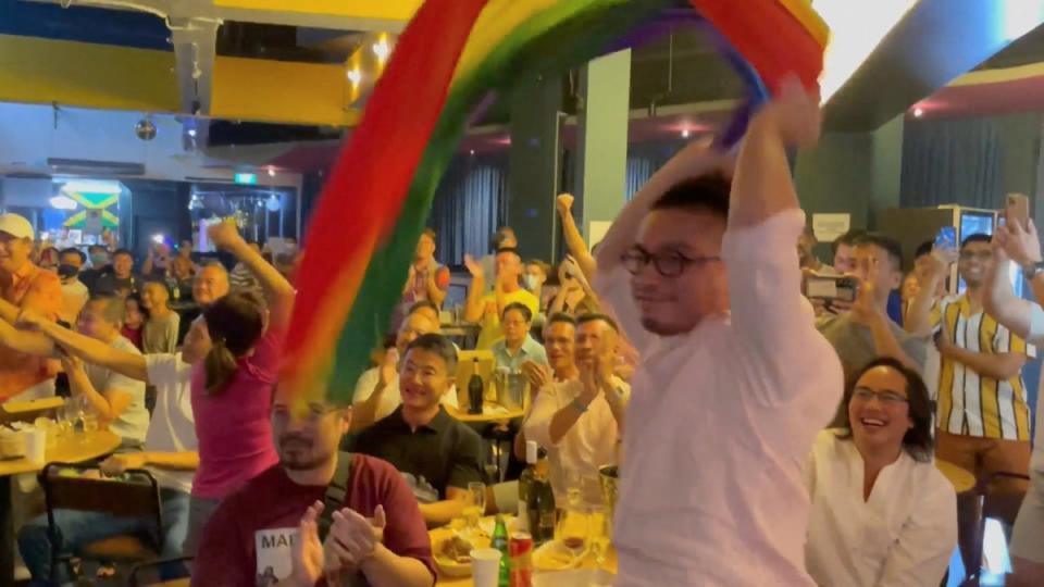 People react as Singapore's Prime Minister Lee Hsien Loong announces that Singapore will decriminalise gay sex (Boo Junfeng via REUTERS)