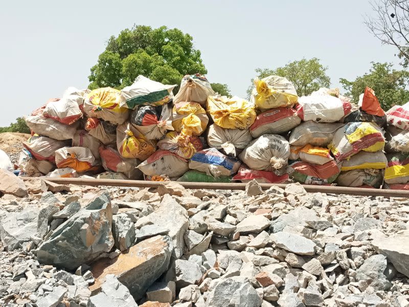 Bags full of gold-bearing ore are seen prior to the ore being processed and gold extracted at aan artisanal mining site near Dano,