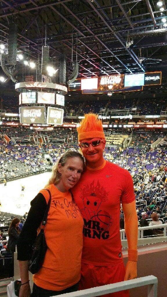 Phoenix Suns fan Mr. ORNG and his mother Carol Mead at one of the team's home games.