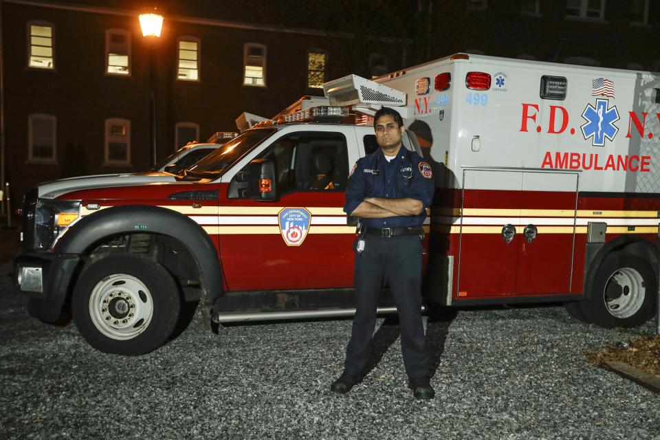 In this Wednesday, April 8, 2020, photo, New York City Fire Department paramedic Ravi Kailayanathan poses for a portrait in New York. (AP Photo/Frank Franklin II)