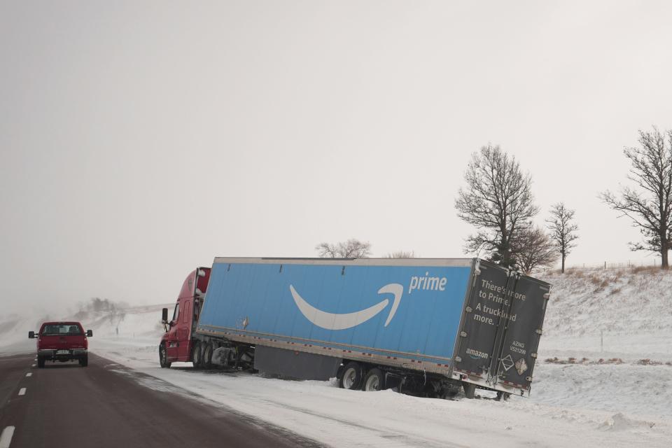 An abandoned Amazon Prime truck is pictured along I-80 East, Saturday, Jan. 13, 2024, in Malcom, Iowa. (AP Photo/Abbie Parr) ORG XMIT: IAAP602