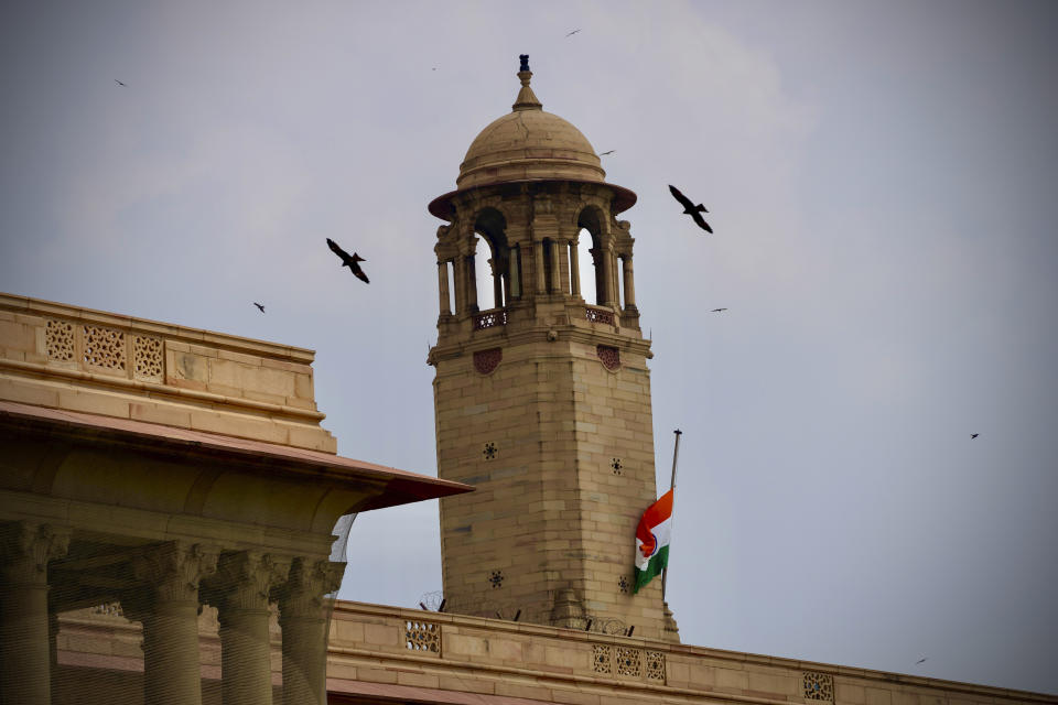 The Indian flag flies at half-mast at the Indian Government's North Block building that houses important ministries following Thursday’s death of Britain's Queen Elizabeth II in New Delhi, India, Sunday, Sept.11, 2022. (AP Photo/Manish Swarup)