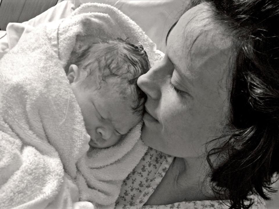 Kate Stanton-Davies pictured with her mother, Rhiannon, moments after her birth in March 2009 (Richard Stanton)