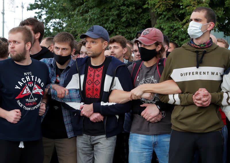 Demonstrators take part in a protest after the Belarusian election commission refused to register Viktor Babariko and Valery Tsepkalo as candidates for the upcoming presidential election in Minsk