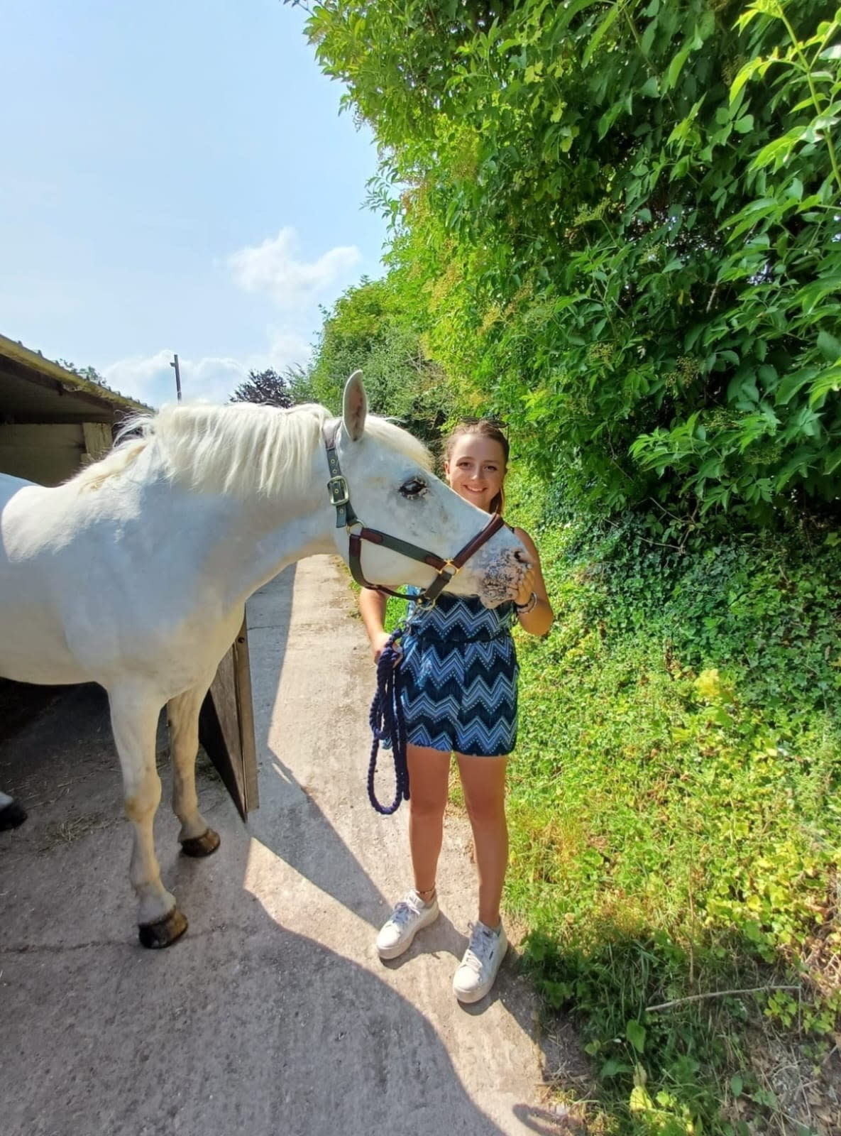 Eleanor Bell, pictured with her horse, says she avoids going on holiday, preferring to stick to her usual routine. (Supplied)