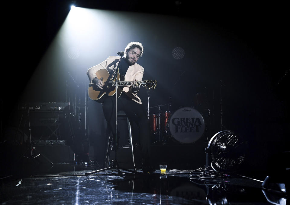 In this photo provided by Universal Music Group, Post Malone performs at Sir Lucian Grainge's 2019 Artist Showcase Presented by Citi on Saturday, Feb. 9, 2019 in Los Angeles. Universal Music Group's annual pre-Grammy showcase featured several artists, including Post Malone, YG, Lil Baby and K-Pop sensation BLACKPINK, who made their first U.S. debut performance. (Jordan Strauss/Universal Music Group via AP)