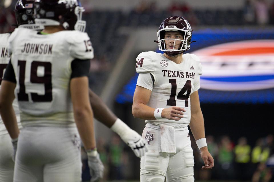 Sep 30, 2023; Arlington, Texas; Texas A&M Aggies quarterback Max Johnson (14) checks the time clock during the second half against the Arkansas Razorbacks at AT&T Stadium. Jerome Miron-USA TODAY Sports