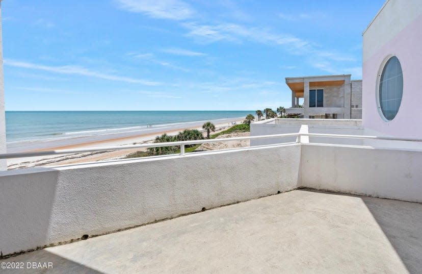 French doors open onto the sprawling first-floor patio with magnificent ocean views.