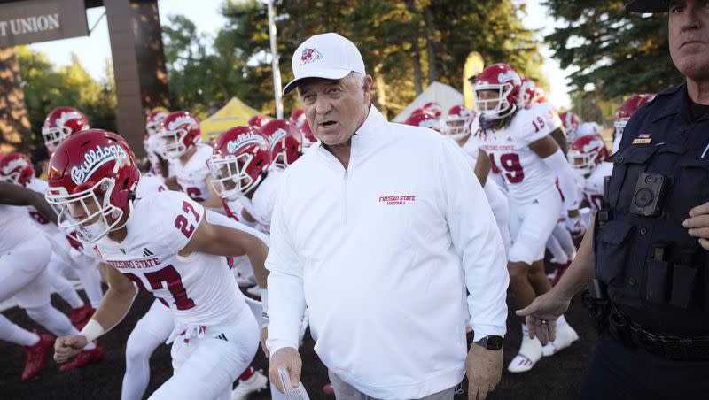 Fresno State coach Jeff Tedford leads his team onto the field for a college football game against Wyoming on Saturday, Oct. 7, 2023, in Laramie, Wyo.