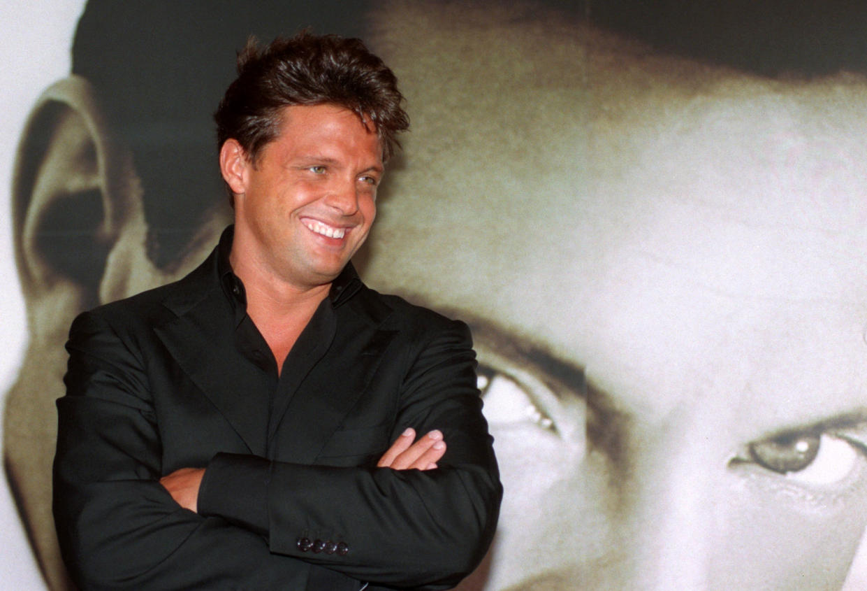 Mexican singer Luis Miguel poses next to a huge picture of himself before a news conference in Madrid April 29. Luis Miguel will start a tour of concerts in Spain on May 1st.