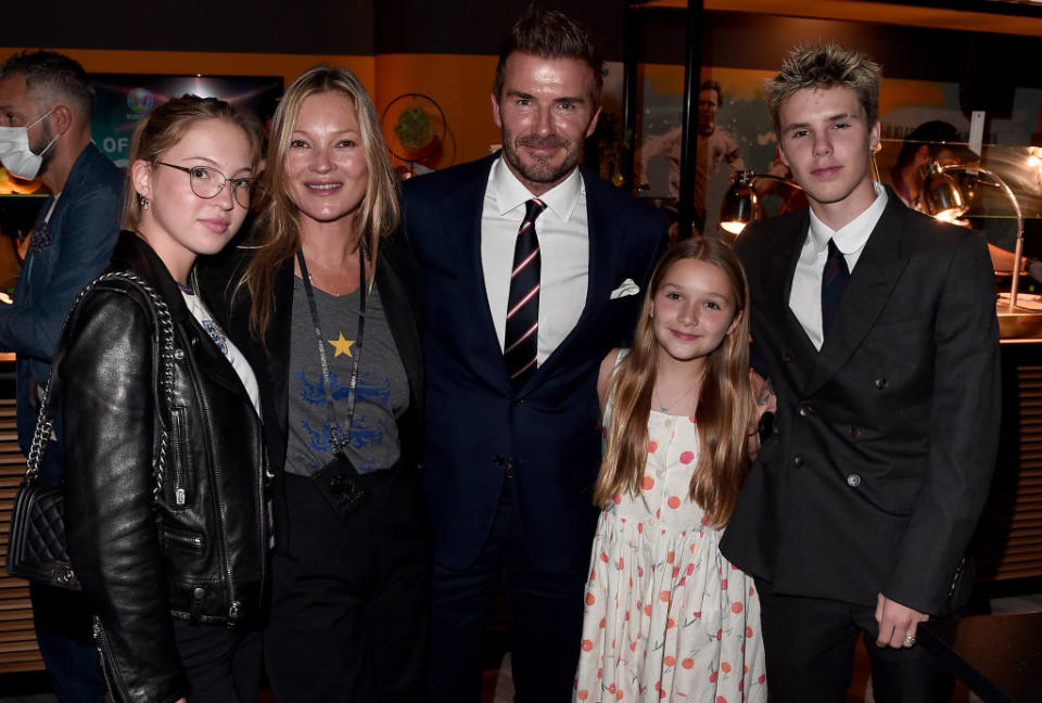 David Beckham is going to miss his daughter Harper, when she goes back to school, pictured in July 11, 2021 with Cruz Beckham, Kate Moss and her daughter Lila Moss. (Getty Images) 