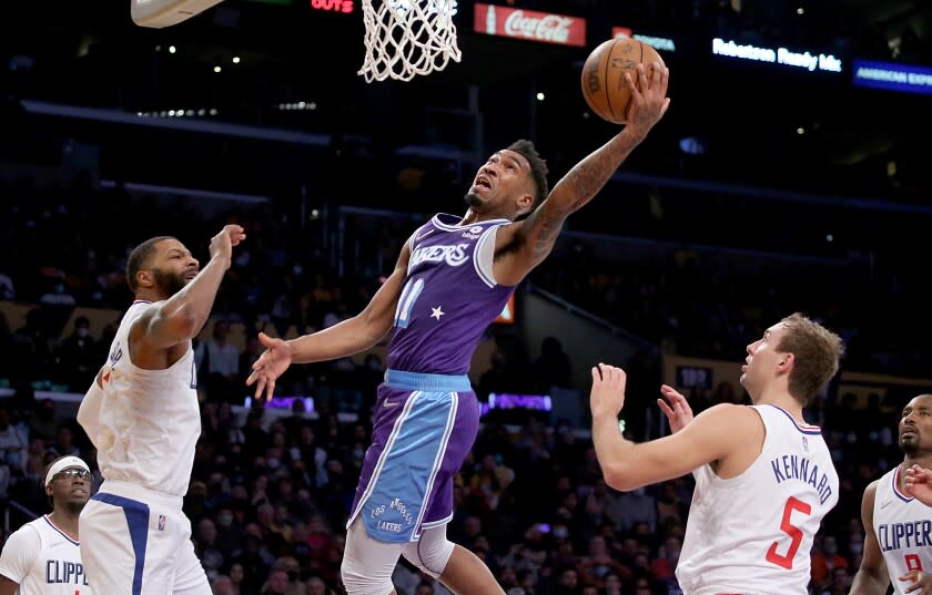 LOS ANGELES, CALIF. - DEC. 3, 2021. Lakers guard Malik Monk drives and scores against the Clippers in the fourth quarter of Friday night's game, Dec. 3, 2021, in Los Angeles. (Luis Sinco / Los Angeles Times)