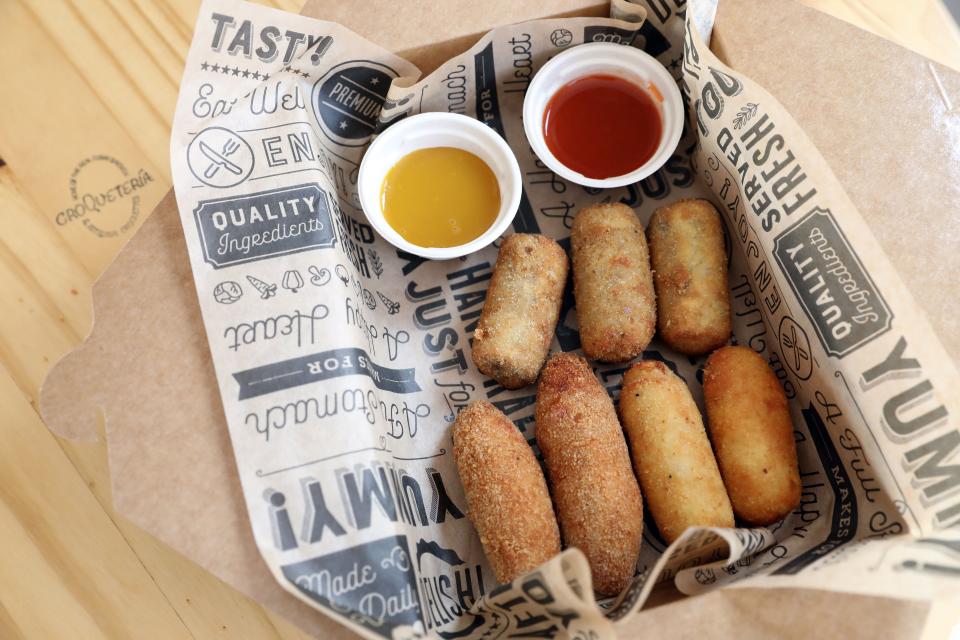 Assorted artisanal croquettes with honey mustard and hot sauce is served at Croqueteria in Sleepy Hollow, Sept. 22, 2020. 