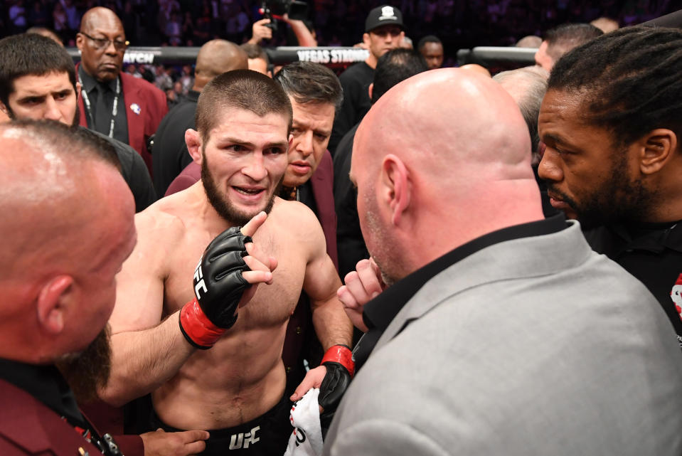 Lightweight champion Khabib Nurmagomedov talks with UFC president Dana White in the Octagon following his fourth-round submission of Conor McGregor on Oct. 6 at UFC 229 in Las Vegas. (Getty Images)