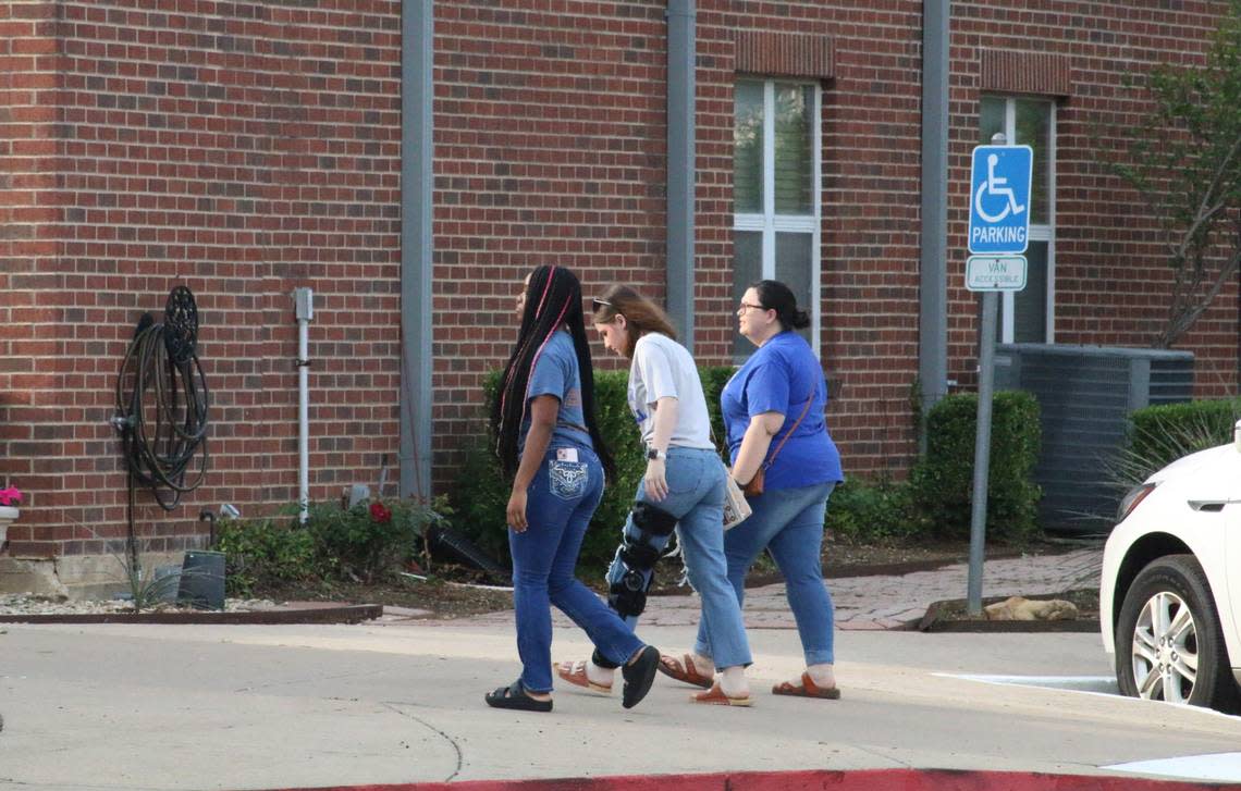 Bowie High sophomores Elizabeth Hyden (middle) and Nalani Patterson (left) attended a prayer service at St. Andrew’s Methodist Church in Arlington to show their support for Etavion Barnes, 18, the student who was fatally shot outside the school.