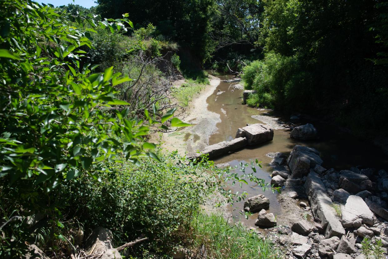 Remnants of an old bridge are seen along Squaw Creek in Brown County. The name, which is an ethnic, racial and sexist slur, particularly for Indigenous women, is one of six in Kansas that are expected to be changed by federal officials.