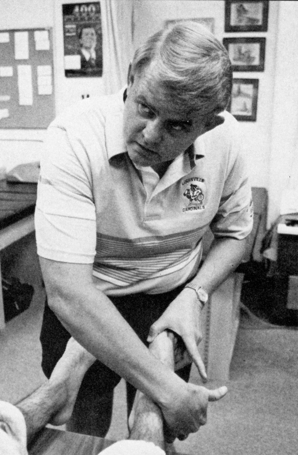 Jerry May, the longtime assistant athletic director for sports medicine at the University of Louisville, administers treatment during the 1988 college sports season. May died Sunday at age 72.