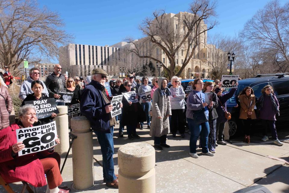 A counterprotest for anti-abortion group for Right to Life gathers across the street from the Potter County Courthouse in downtown Amarillo ahead of a Women's March protest in early February.