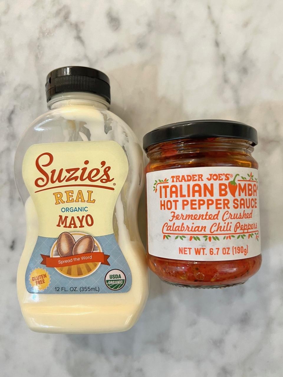 Mayo and Italian Bomba sauce on a countertop.