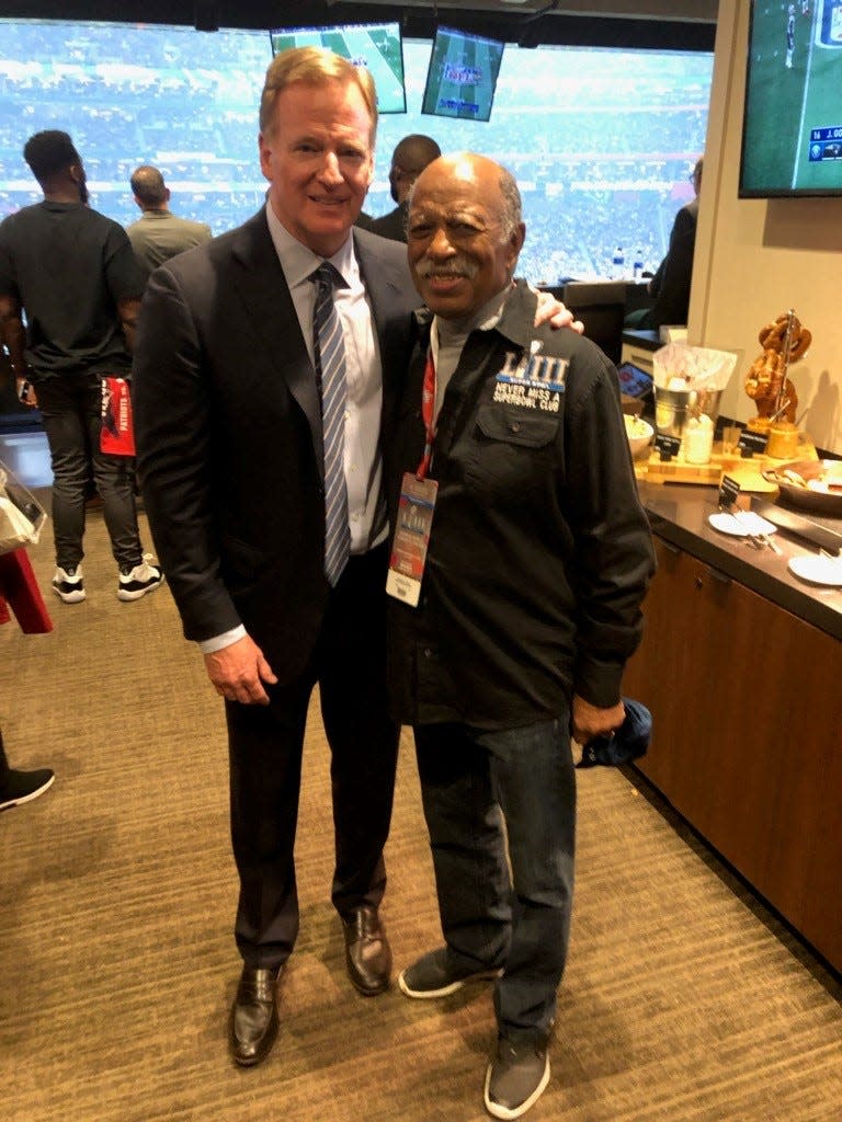 NFL Commissioner Roger Goodell with Lansing businessman  Greg Eaton in the commissioner's suite during Sunday's Super Bowl in Atlanta.