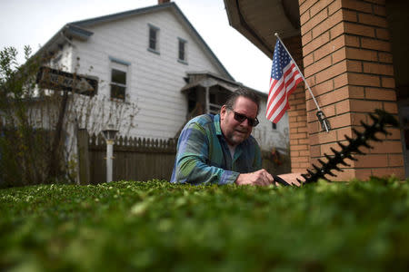 Gary Baker, 64, trims his hedge in Northampton, Pennsylvania, U.S. April 24, 2017. Northampton County voted for Obama in 2008 and 2012, but Trump in 2016. REUTERS/Mark Makela