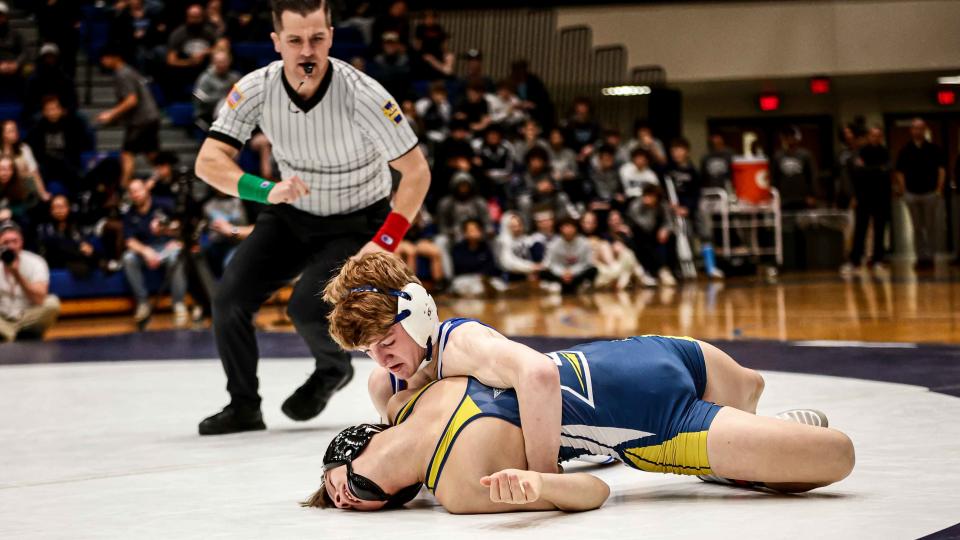Ashton Kriss (ELCO) tries his best to keep his back off the mat as Aaron Seidel (NL) takes control early. The two-day LL League wrestling championships concluded Saturday, Jan. 28, 2023 at Manheim Township.