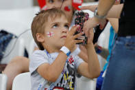 <p>A young England fan gets in the mood ahead of the big game (AP) </p>