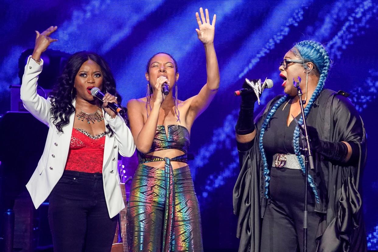 Left to right, Ruby Amanfu, Allison Russell and Shea Diamond perform during the Love Rising concert at Bridgestone Arena in Nashville, Tenn., Monday, March 20, 2023.