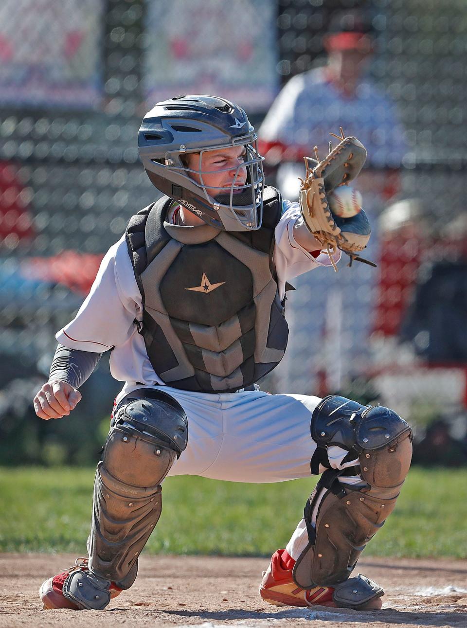 Hingham High senior baseball catcher Ben Cashman in action against Marshfield on Wednesday, May 18, 2022.