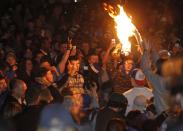 University of Kentucky fans and students take to the streets after the University of Connecticut defeated Kentucky in the NCAA Men's National Basketball Championship near the university campus in Lexington, Kentucky, April 7, 2014. REUTERS/John Sommers II (United States - Tags: SPORT BASKETBALL CIVIL UNREST)