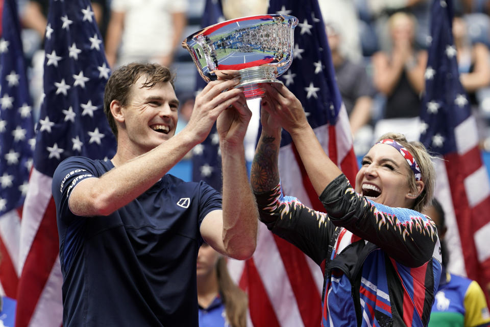 Jamie Murray, of the United Kingdom, left, and Bethanie Mattek-Sands, of the United States, hold up the championship trophy after winning the mixed doubles final against Hao-Ching Chan, of Taiwan, and Michael Venus, of New Zealand, at the U.S. Open tennis championships Saturday, Sept. 7, 2019, in New York. (AP Photo/Eduardo Munoz Alvarez)