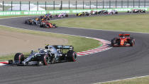 Mercedes driver Valtteri Bottas of Finland leads Ferrari driver Sebastian Vettel of Germany at the start of the Japanese Formula One Grand Prix at Suzuka Circuit in Suzuka, central Japan, Sunday, Oct. 13, 2019. (AP Photo/Toru Takahashi)