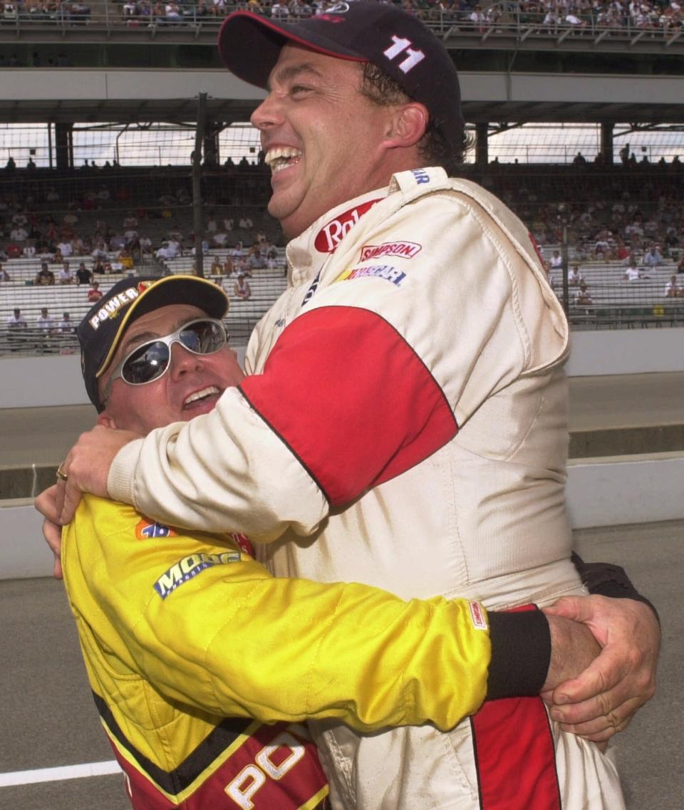 Brett Bodine gets a bear hug from his brother Geoff after setting a track record in qualifying for the Brickyard 400 at the Indianapolis Motor Speedway on Aug. 4, 2000.