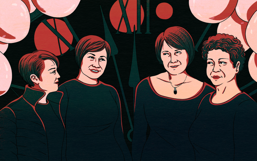 An illustration of four women smiling. They are standing in front of a clock about to tick to midnight.