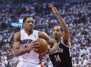 Toronto Raptors' DeMar DeRozan, left, drives on Brooklyn Nets' Shaun Livingston during the first half of Game 1 of an opening-round NBA basketball playoff series, in Toronto on Saturday, April 19, 2014. (AP Photo/The Canadian Press, Chris Young)