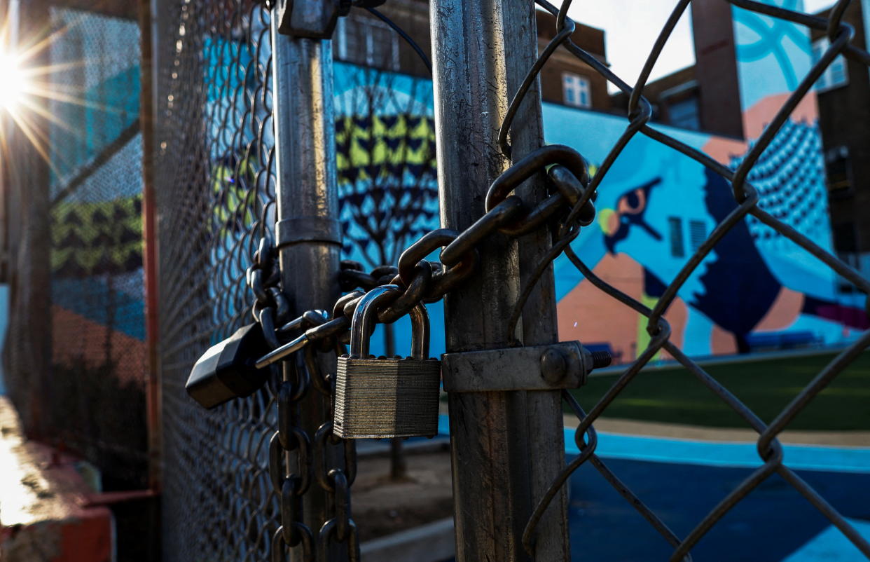 A locked gate outside a school.