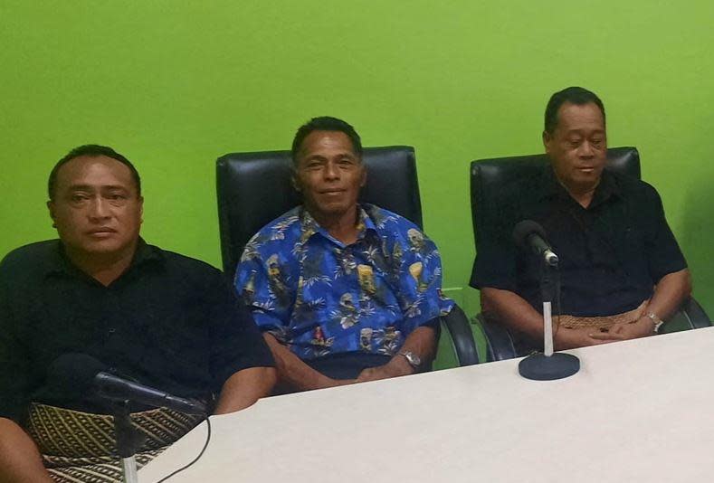Lisala Folau (center), a Tongan man who says he swam for around 27 hours  after getting swept to sea by Saturday's tsunami, sits with other people  from Tonga's Atata island, during a media availability in Nuku'alofa, Tonga, January 19, 2022 in a picture  obtained from social media. / Credit: Marian Kupu/Broadcom Broadcasting FM/via REUTERS